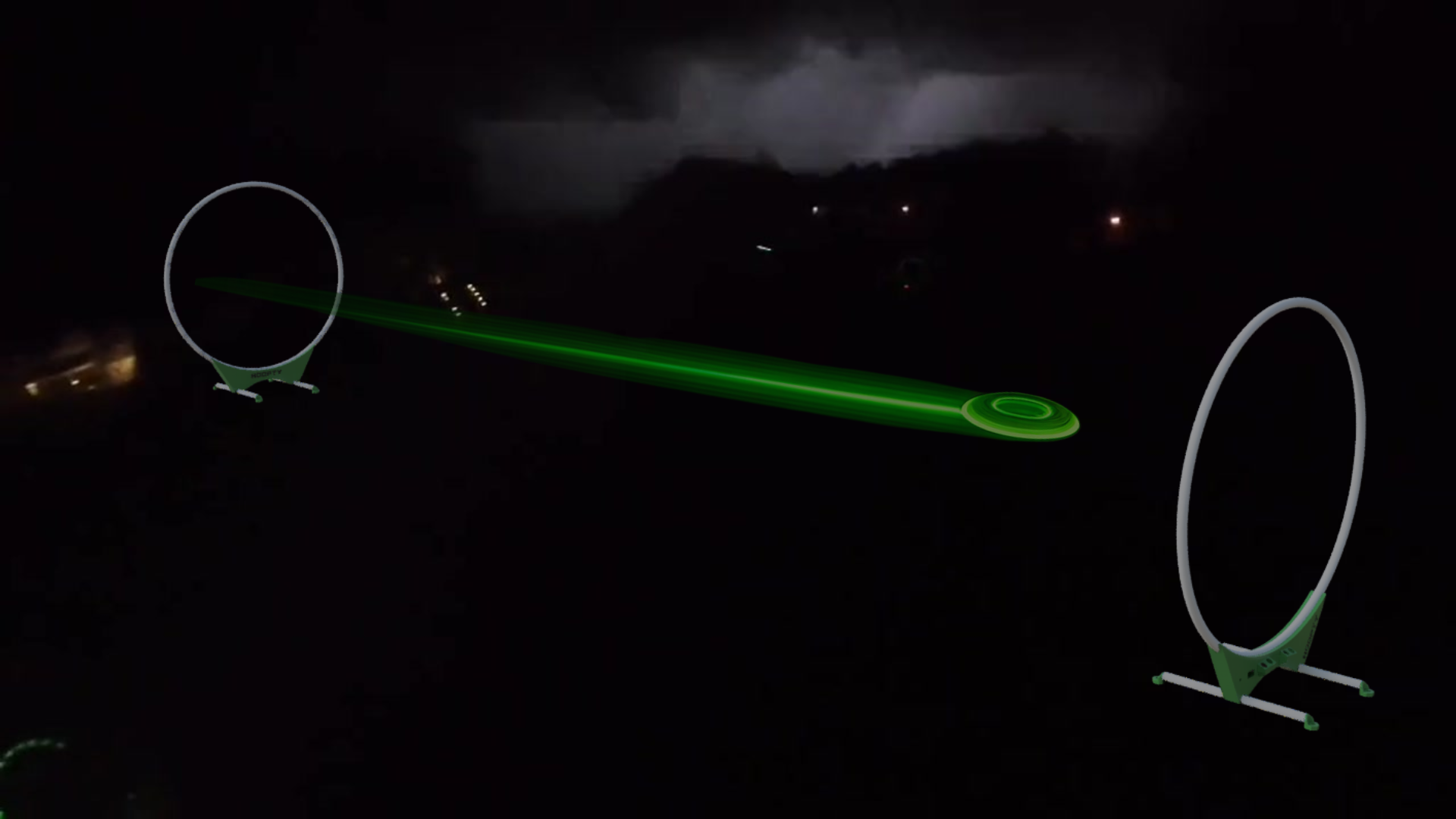 Load video: Video shows a real game of the backyard game Hoopty Disc at night with one player scoring three points, known as a Hoopty, while lightning crashes in the background.